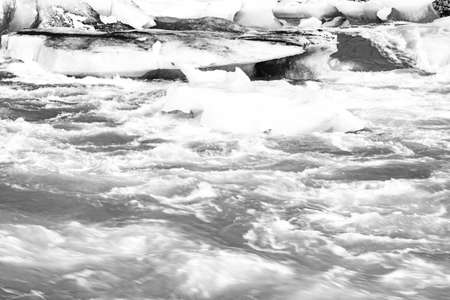 Icebergs floating in the cold water of the Jokulsarlon glacial lagoon. Vatnajokull National Park, in...