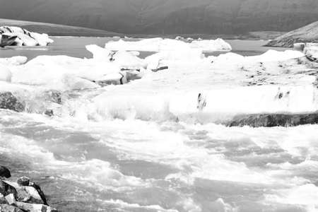Icebergs floating in the cold water of the Jokulsarlon glacial lagoon. Vatnajokull National Park, in...