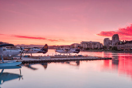 VICTORIA, BC, MAY 08 2019: Downtown Victoria, Canada. Night scene of the harbour in downtown victoria, british columbia, canada. Water planes in foregroundのeditorial素材