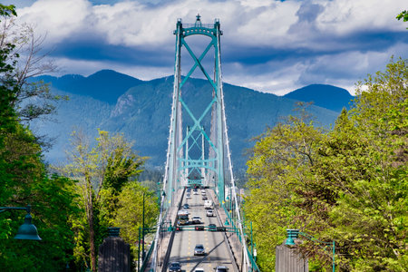 VANCOUVER - MAY 05 2019: Chinatown, Vancouver Canada. Lions Gate Suspension Bridge in Vancouver BC with Trafficのeditorial素材
