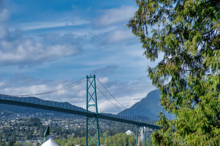 VANCOUVER - MAY 05 2019: Chinatown, Vancouver Canada. Lions Gate Suspension Bridge in Vancouver BC with Trafficのeditorial素材