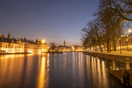 The Hague - February 17 2019: The Hague, The Neherlands. Binnenhof castle, Dutch Parliament, with the court pond in the middle, and a blue sky, The Hague, Den Haag, The Netherlands.のeditorial素材