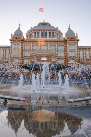 The Hague, The Netherlands - May 14 2020: The backside of the Kurhouse hotel with fontain in foreground, at dusk, in Scheveningen, the Netherlandsのeditorial素材