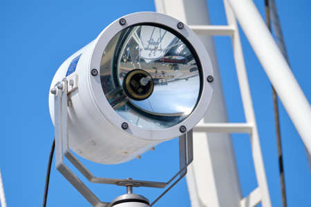 composition is navy consisting of a lamp, and masts against a blue sky. Background consept.