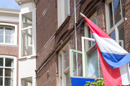 The Hague, The Netherlands - May 15 2020: Soap bubbles flying slowly through the air. Houses in the backgroundのeditorial素材