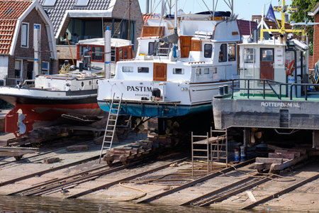 Urk, The Netherlands - June 22 2020: Three yachts for repair and maintenance in the dockyard of Urk, the Netherlandsのeditorial素材