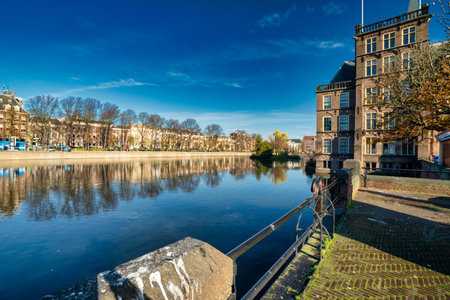 The Hague, The Netherlands - November 9, 2020: Almost deserted park by the pond in the city. Park seen over the water Covid-19 pandemic Concept: COVID-19.のeditorial素材