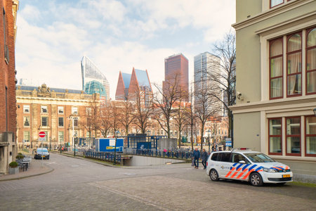 The Hague, The Netherlands - November 10, 2020: In the center of The Hague, the police are vigilant, some people with mouth masks. Empty cafes and few people on the street. Concept Covid-19のeditorial素材