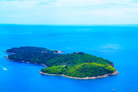 Beautiful view of the island of Lokrum near the historic city of Dubrovnik, Croatia on a sunny day.の写真素材