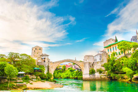 A beautiful view of the old bridge across the Neretva River in Mostar, Bosnia and Herzegovina, on a sunny summer dayのeditorial素材