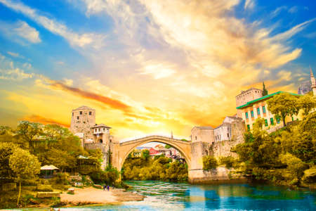 A beautiful view of the old bridge across the Neretva River in Mostar, Bosnia and Herzegovina, on a sunsetのeditorial素材