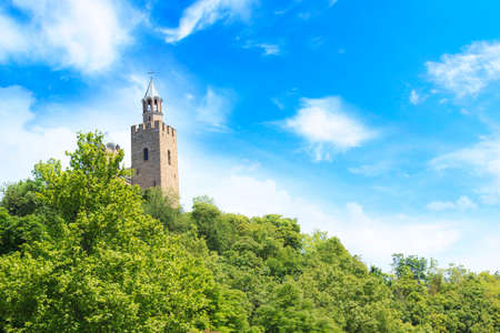 A beautiful view of the Tsarevets fortress among the green hills in Veliko Tarnovo, Bulgariaの写真素材