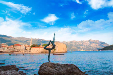 Beautiful view of the sculpture Ballerina Dancer of Budva at sunset, Budva, Montenegroの写真素材