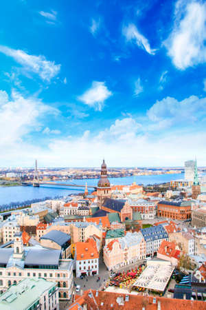 Beautiful view of the old town and the steeple of the Dome Cathedral near the Daugava River in Riga, Latviaのeditorial素材