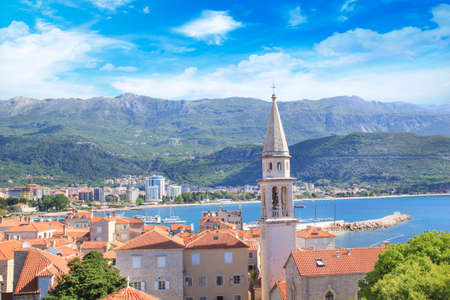 View of the rooftops and the bay of Budva in Montenegro in the summer sunny dayのeditorial素材