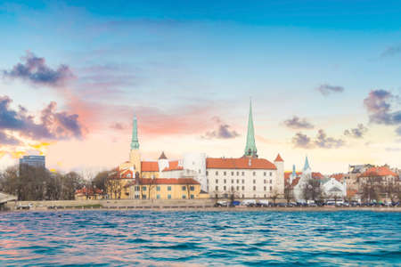 Beautiful view of the Riga Castle, St. Peter's Church and the Tower of the Dome on the banks of the...