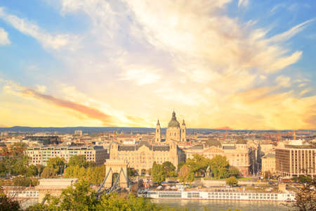Beautiful view of the Basilica of Saint Istvan and the Szechenyi chain bridge across the Danube in Budapest, Hungaryの写真素材