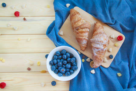 A nutritious healthy breakfast of croissants and berries