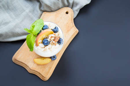 Healthy blueberry, peach and walnut parfait in a glassvの写真素材