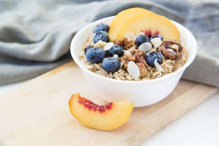 Oatmeal porridge with blueberries. Superfood for healthy nutritious breakfast