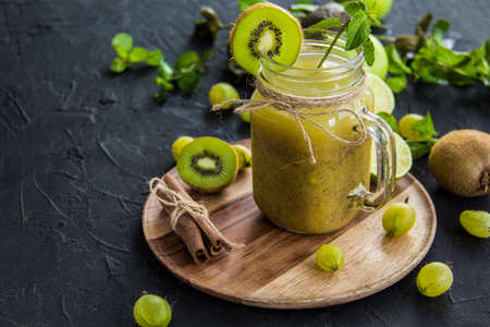 Healthy smoothie of fresh green fruits. Creative atmospheric decorationの写真素材