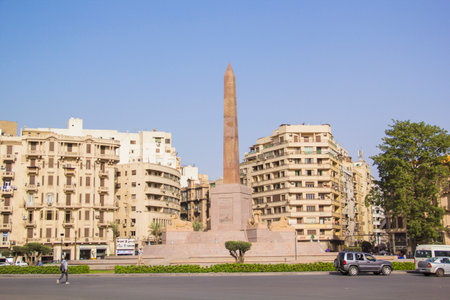 CAIRO, EGYPT - DECEMBER 29, 2021: The Obelisk of Ramses II surrounded by four ancient sandstone sphinxes in Cairo, Egyptのeditorial素材