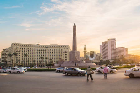 CAIRO, EGYPT - DECEMBER 29, 2021: The Obelisk of Ramses II is surrounded by four ancient sandstone...