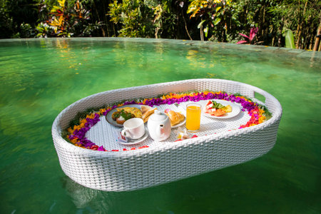 Beautiful view of the breakfast in a swimming poolの写真素材