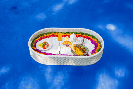 Beautiful view of the breakfast in a swimming poolの写真素材