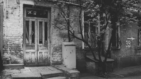 Old Wooden Door In A Brick Wall