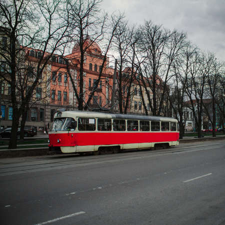 Famous Wiener Ringstrasse with historic Burgtheater Imperial Court Theatre and traditional red electric tram at sunrise with retro vintage style filter effect in Vienna, Austriaのeditorial素材