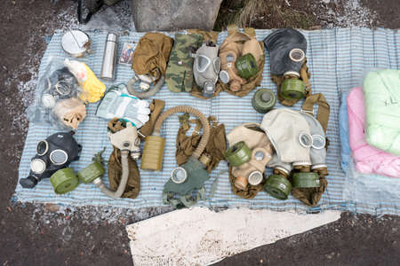 Saint Petersburg, Russia - February 15, 2020: old Russian gas masks, uncluding Soviet GP-5 with a price tag "200 rubles" (around 3 US dollar) at Udelnaya flea market. A popular souvenir from Russia.のeditorial素材