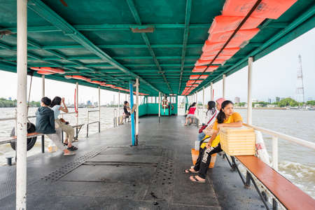 Bangkok - July 20, 2019: a large ferry with passengers crosses the Chao Phraya River from Ta Luean (Taluean) Pier (Tambon Bang Nam Phueng) to Bangna Pier. Ta Luean Pier is a way to famous Bang Krachaoのeditorial素材