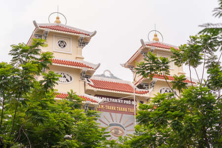 Ho Chi Minh City, Vietnam - April 28, 2019: the facade of Cao Dai temple Thanh That Nam Thanh (Thanh That Cau Kho) in Nguyen Cu Trinh Street in District 1.のeditorial素材
