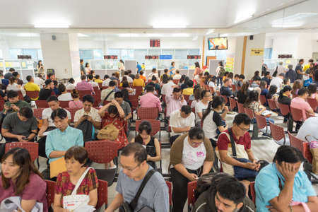 Bangkok - July 11, 2019: people wait to apply for extension of visa and getting re-entry permit (in...
