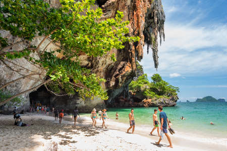 Railay, Thailand - July 3, 2018: tourists on Phra Nang (Phranang) Beach with its stalactites and the Princess Cave.のeditorial素材