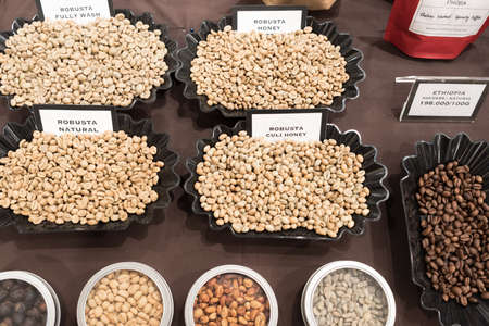 Ho Chi Minh City, Vietnam - April 29, 2018: Samples of different sorts of raw Robusta coffee beans...