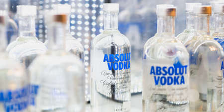 Istanbul, Turkey - April 25, 2018: bottles of Absolut Vodka on a shelf of a duty free shop in Istanbul Ataturk Airport.のeditorial素材