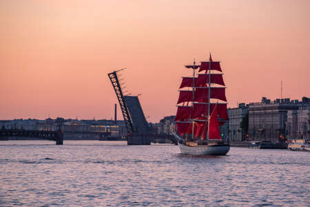 Saint Petersburg, Russia - June 10, 2021: a brig Rossiya sails on the Neva River at sunrise. The...