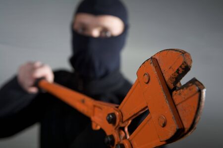 crimininal robber in action with a equipmentの写真素材