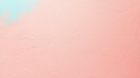 A rough, uneven surface painted in pastel pink with a splash of light turquoise in the corner, showing texture, cracks, and relief.の素材