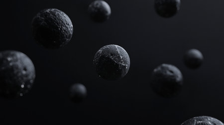 A collection of dark, textured spheres of varying sizes appear to float in a dark space, creating an abstract and visually intriguing composition.の素材