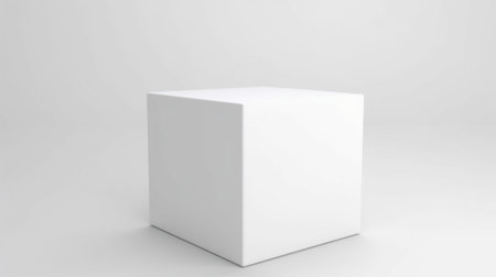 A clean, white rectangular prism object is presented in a studio setting, ready for product display.の素材