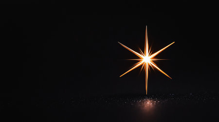 A brilliant six-pointed star radiates intense orange and yellow light from its core, casting a warm glow and reflection on a dark, glitter-dusted surface below.の素材