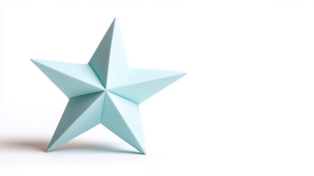 A beautiful light blue star stands out against a clean white background, perfect for various design projects.の素材