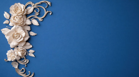 A beautiful composition featuring white flowers and decorative elements against a striking blue backdrop, perfect for design projects.の素材