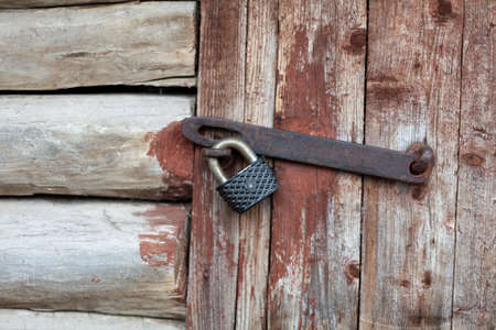 padlock on an old wooden door