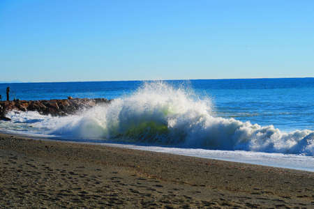 Big wave breaking on the beach in Savona, Liguria, Italy