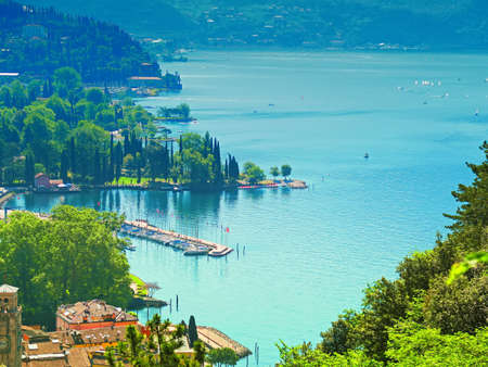 View of Lake Garda from the mountains above Riva del Gardaの写真素材