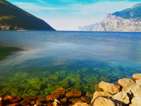 Lake Garda seen from the shore of Torbole, Trentino, Italyの写真素材